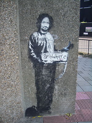 A stencil of Charles Manson in a prison suit, ...
