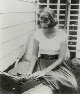 Sylvia Plath at her typewriter, 1956
